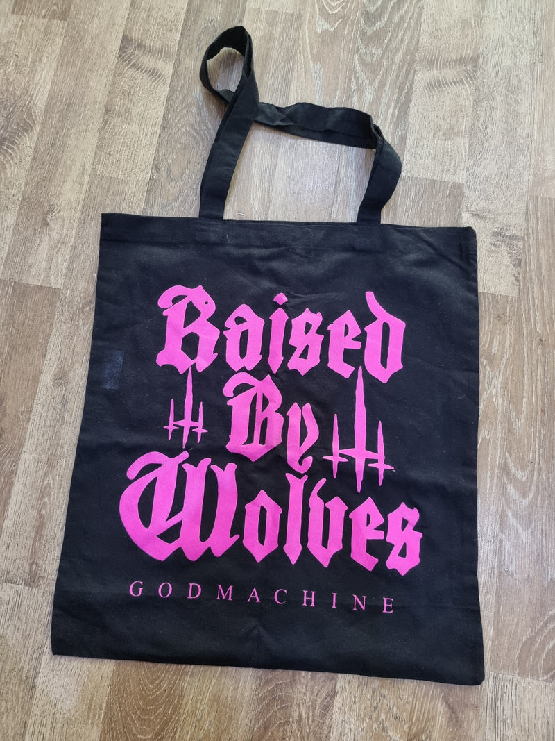 Raised by wolves tote bag